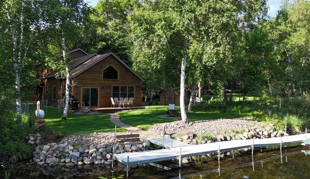 Spacious Summer Escape: Private Backyard, Dock & Fire Pit, Channel Waterfront
