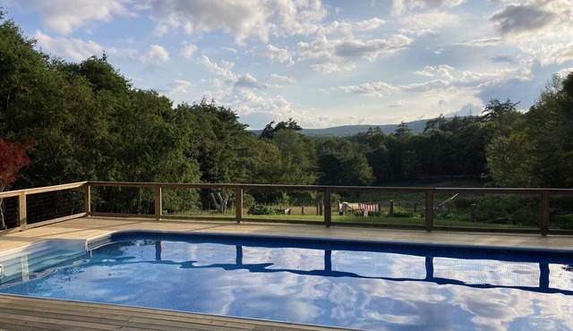 Spacious, unique home w/mountain views. Enjoy pool in summer, skiing in winter!