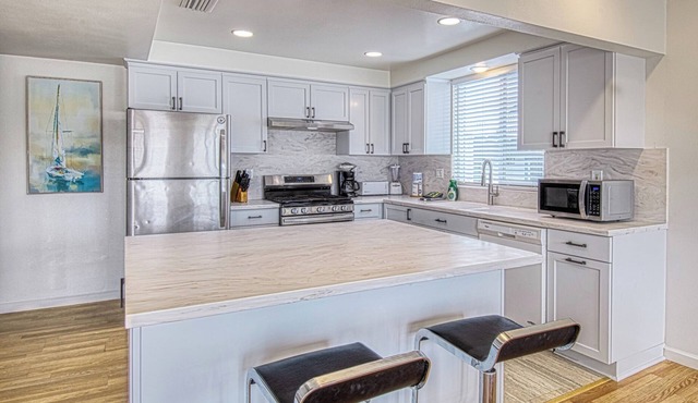 Spacious Upper unit located just two houses from the sand!