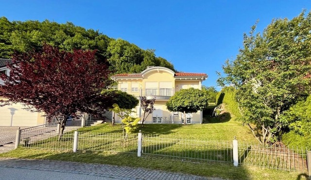 Spacious vacation home with views of the Alps, large balcony and terrace.