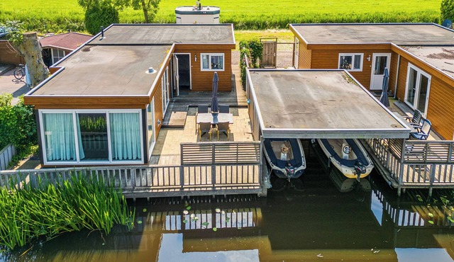 Spacious waterfront chalet including a sloop