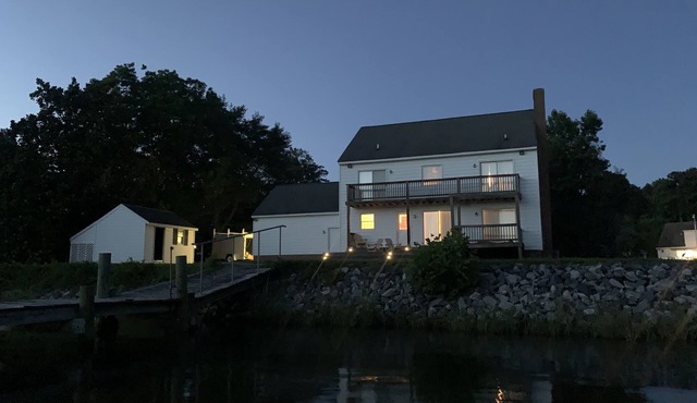 Spacious waterfront home with dock and sunset view