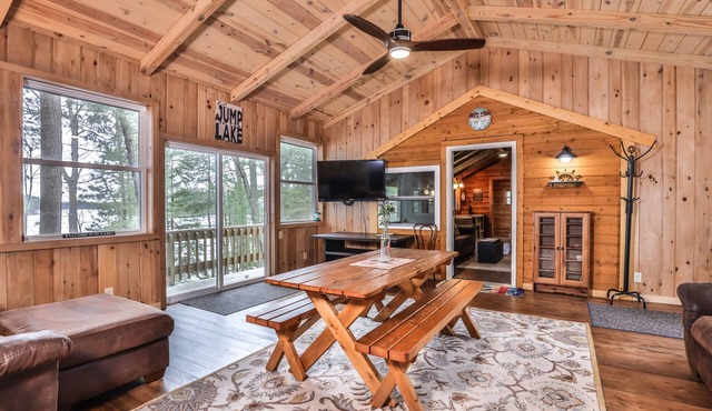 Splendid lakefront home with deck, private W/D, fireplace, and patio area