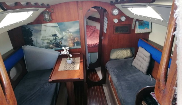 Stay on a charming sailboat at the quayside.