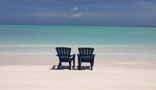 Step from your porch onto the soft white sand & crystal clear water.
