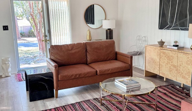 Step into the centrally located Cowgirl Cottage, a peaceful retreat on the woods