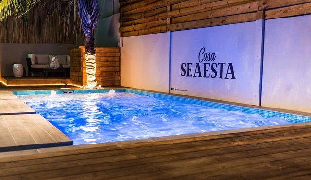 Steps away from the beach, this fully stocked house is perfect for your group!