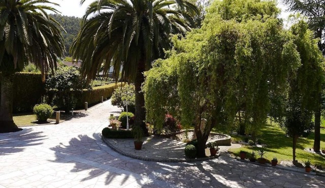 stone chalet with pool and garden areas