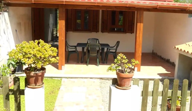 Studio apartment with patio in front and back terrace with veranda