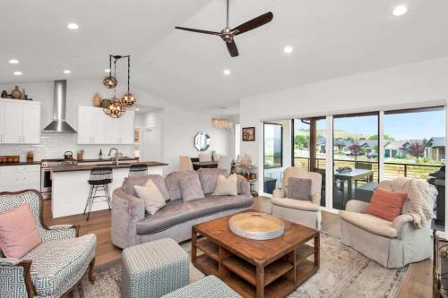 Stunner with Lake Mountain Views and Private Hot Tub