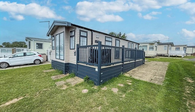 Stunning caravan with side decking just a short walk to Hembsy beach ref 00069BA