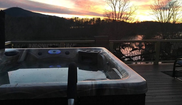 Stunning Cedar 4 BR , 3 full bath hm with amazing views of the lake & mountains. Private deep water dock with adjacent floating dock. Located in the largest NO Wake Cove on the lake, perfect for swimming and kayaking/paddle boarding.