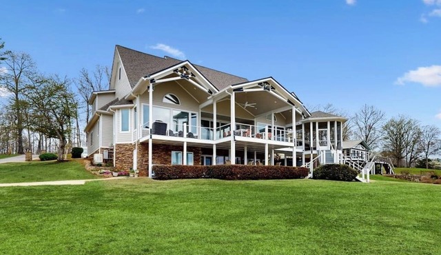 Stunning lakefront home with kayaks, dock, fireplace, game room, & washer/dryer