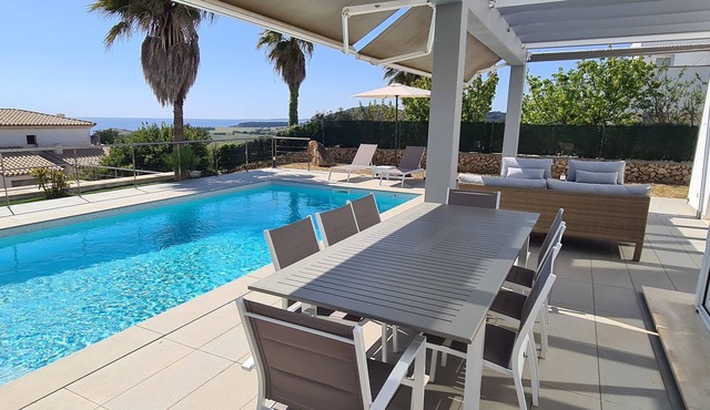 Stunning modern villa with stunning Son Bou beach views, heated pool