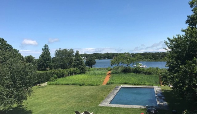 Stunning Waterfront Home with Pool, Boat Dock, and Acre of Land