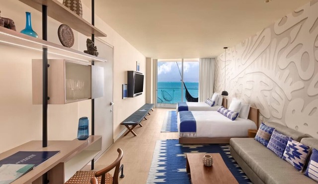 Stylish Beachfront Stay with Marina, Swimming Pool, Spa & Golf Nearby