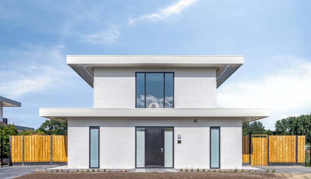 Stylish detached 6-person villa with private sauna, three en-suite bathrooms and private dock on the water