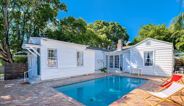Stylish, dog-friendly home with a pool, enclosed yard, patio, & central AC