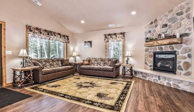 Stylish dog-friendly cabin with hot tub, fireplace, patio, grill, central AC, & W/D