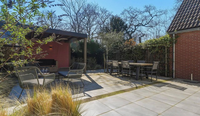 Stylish vacation home with bright furnishings and garden and terrace and porch.