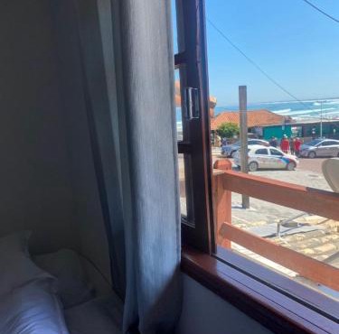 Suites e Quartos Em frente a Praia Grande -Na orla Flavia Alessandra