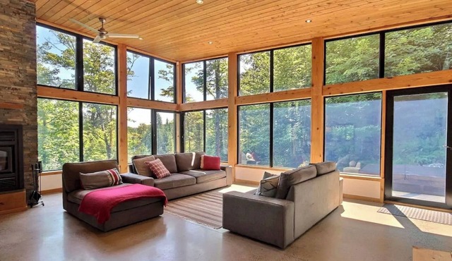 Sun-drenched modern gem overlooking low-key beavers pond