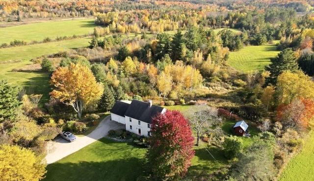 Sun-filled, quiet country home on 27 acres with mountain views