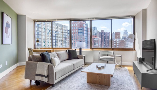 Sunlit UES 2BR w/DM, Elevator & Gym, nr Central Park, by Blueground