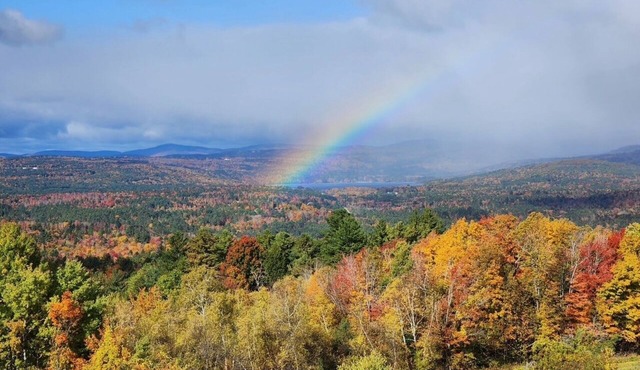 Sunset Slopes: A spacious 4-bedroom home in scenic Wilmot, NH, with garden views.