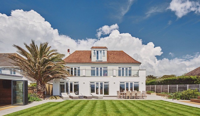 Superb beach house with beautiful garden with hot tub and private beach access