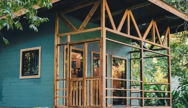 Surfside tiny home with modern amenities like AC, modern design, bathtub,and TV.