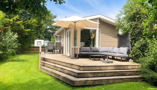 Surrounded by greenery and trees you will find this lovely four-person chalet. After a visit to the beach, you can enjoy all the luxury and comfort of your holiday chalet.