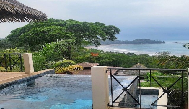 Sweeping ocean views, private infinity edge pool, & short walk to beach