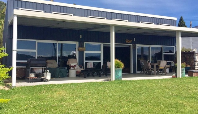 Te Waitere Village spectacular water views of harbour and surrounding hillsides.