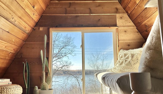 Techni Cabin offers a cozy A-frame blending rustic charm with modern comforts.