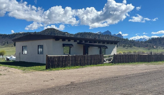 The Adobe - remodeled historical adobe cabin on a high country working ranch.