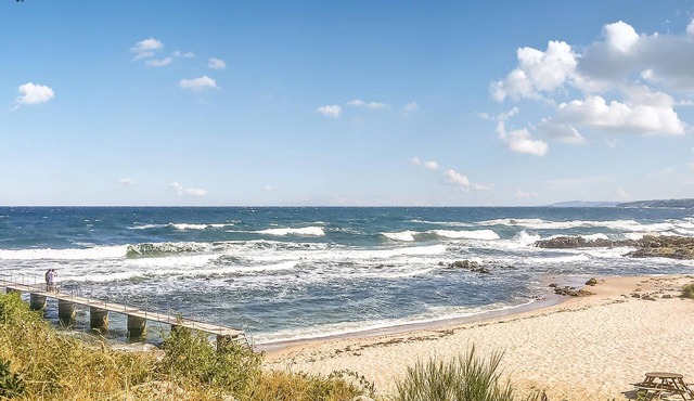 The well-appointed cottage has two floors and offers sea views from the house and the property.