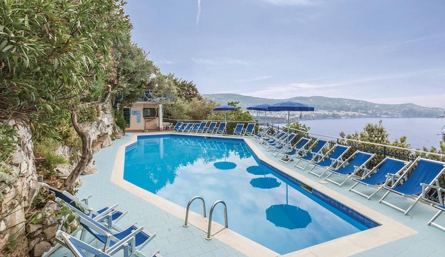 These bungalows are located in a vacation home complex directly above the sea, with panoramic views