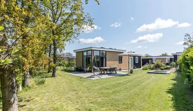 This attractive chalet is located in a beautiful location at the back of Schouwenduin, surrounded by