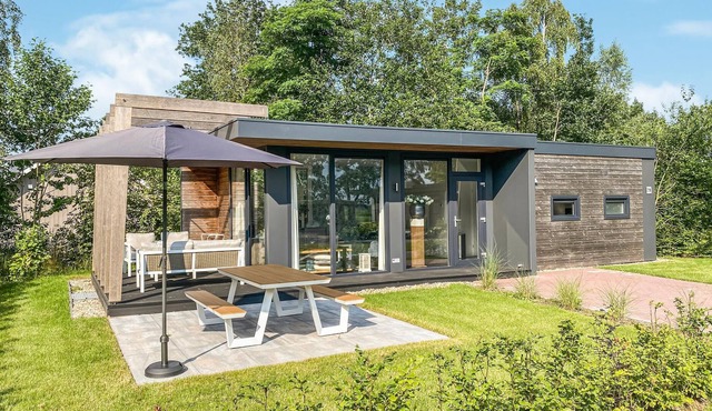 This beautifully decorated vacation home is located in an inviting vacation park, the centerpiece of