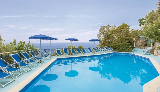 This modern bungalow belongs to a vacation home complex directly above the sea, with a unique panora