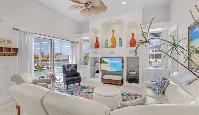 This Villa has it all! Waterfront - heated pool, hot tub, boat dock, tiki hut!