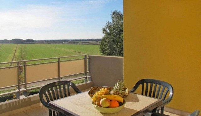 Three-room apartment of 55 sqm, consisting of a large living/dining area with equipped kitchenette and sofa bed with 2 pull-out single beds, a double bedroom, a bedroom with 2 single beds, bathroom with shower and private balcony complete with table and