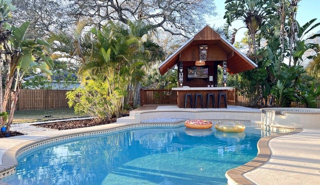 Tiki Oasis on 0.6 acres- 5 min to the beach, clean and modern.