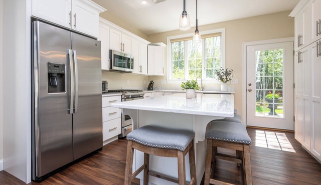 Tranquil cottage with AC, heated pools and game room, close to local beaches.