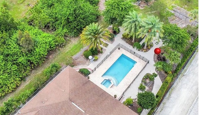 Tranquil Naples Getaway 4BR Home with Pool, Spa Orchard & Pond near Hospitals &