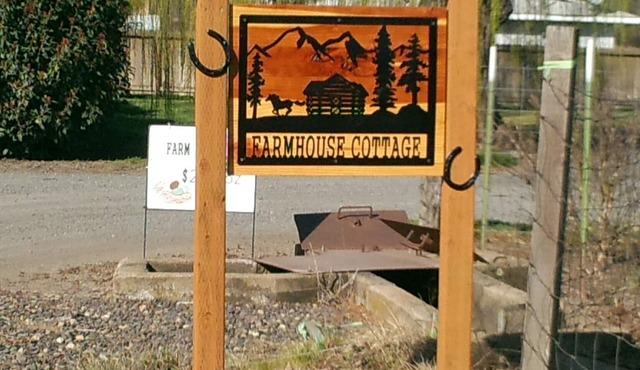 Tranquil setting surrounded by panoramic mountain views, grazing horses