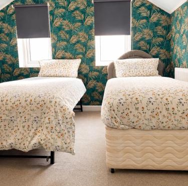 Twin single bedroom perfect for contractors and football fans
