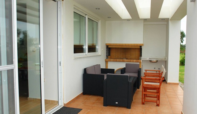 Two bedroom villa with private garden and parking