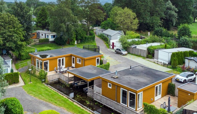 Two large chalets side by side with two sloops